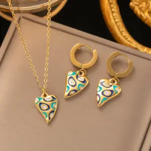 COLLAR CADENA Y ZARCILLOS CON DIJE DE CORAZON MELOCOTON DE ACERO TITANIO